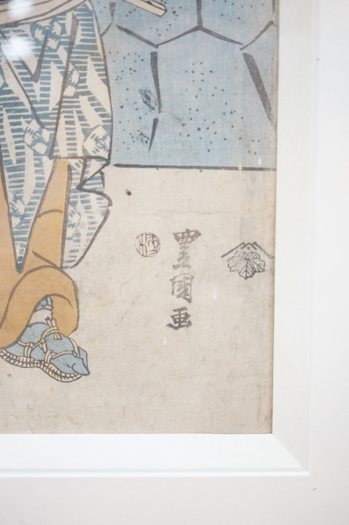 Four Japanese woodblock prints, to include: after Toyokuni - kabuki actors together with a Chinese printed booklet, largest 35 x 23cm. Condition - good